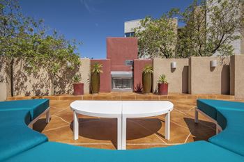 Poolside lounge with fireplace -  ABQ Uptown Apartments